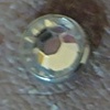 zoom in shot of the same dermal anchor with 14g cz.