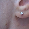 fresh earlobe piercing with white gold stud