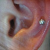 fresh cart. piercing with little 16gauge 5/16ths straight barbell.  Nice and red, not uncommon for a freshly pierced ear cart.
