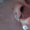 fresh tragus piercing with captive bead ring