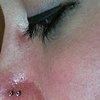 Fresh double nostril piercings with white gold cz nostril screws.