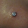fresh nostril piercing with white gold cz stud