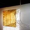 Timothea's wire sculpture compliments the dress pattern lines in Harvey's collage painting. 
