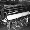 JOHN VACHON
Rolls of newsprint coming off winding machine where it has been cut to size ordered by customers, Southland Paper Mill, Lufkin, TX 
#23151

April 1943

