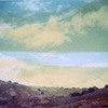 hillside with passing storm clouds