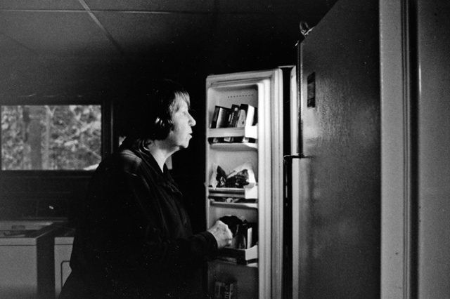 Maggie checks in the fridge for spinach to accompany her last meal of solid food before surgery.  She cannot eat it again for at least three months.