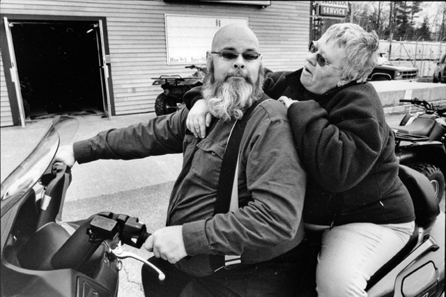 Bill and Suu pick up there scooter outside of Topsham, Maine.