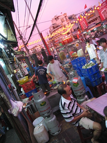 Dinner at a street kiosk, District 10, Ho Chi Minh City.