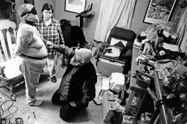 Bill, Suu and Sue "play" in their living room in Freeport, Maine.