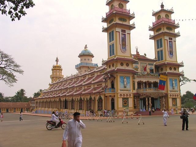 The outside of the Cao Dai Temple.  Founded in 1926, the Cao Dai is a mix of Buddhism, Catholocism, Taoism, Confucianism and Hindu.  Thier saints include Napolean Bonaparte and Victor Hugo.