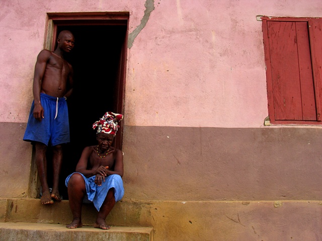 A grandmother and son outside there home, built for war wounded, in Freetown, Sierra Leone