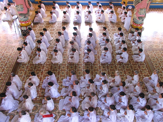 The Cao Dai, a religious sect based in Thay Ninh province, during a daily ceremony.