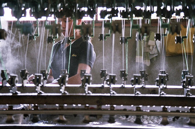 A woman makes silk thread in Dalat.