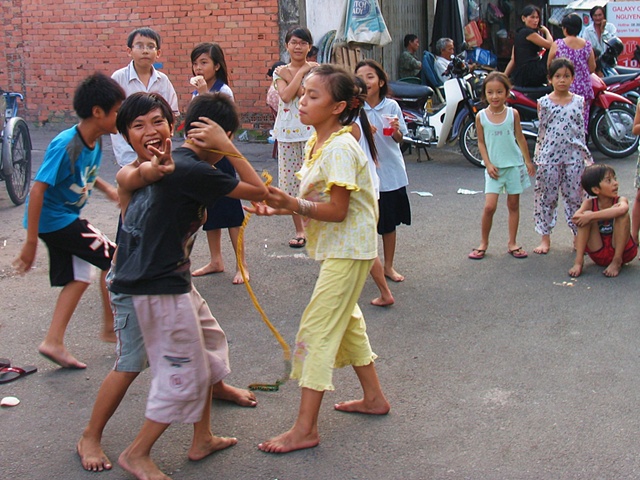 Children play on a back street in Ho Chi Minh City.