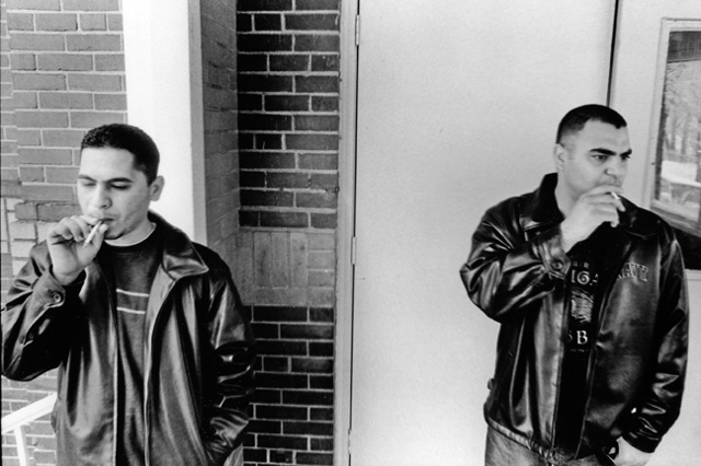 Shark and Steve have a smoke outside of their place in Lewiston, Maine. 