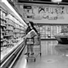 Maggie shops for her husband and family.  She is not partaking in anything in the cart.