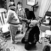 Bill, Suu and Sue "play" in their living room in Freeport, Maine.