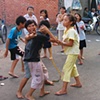 Children play on a back street in Ho Chi Minh City.