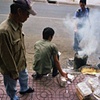 During Tet, burning fake money and shoving the ashes into the public drains for ancestors is a common occurrence in downtown Saigon.
