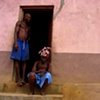 A grandmother and son outside there home, built for war wounded, in Freetown, Sierra Leone