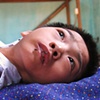 This boy is paralyzed due to his father's exposure to Dioxin during Vietnams war with Cambodia, remnants from before 1975.