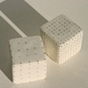 Two Small Cubes with Gold Spots