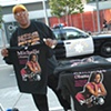 Hawking Michelle Obama T-Shirts Outside the Conference. 