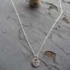 Tiny 'button' pendant 