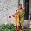 Two summer beach dresses.  Grass green dots and tangerine dots.  