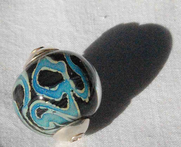 Capped crazy silver bearing bead