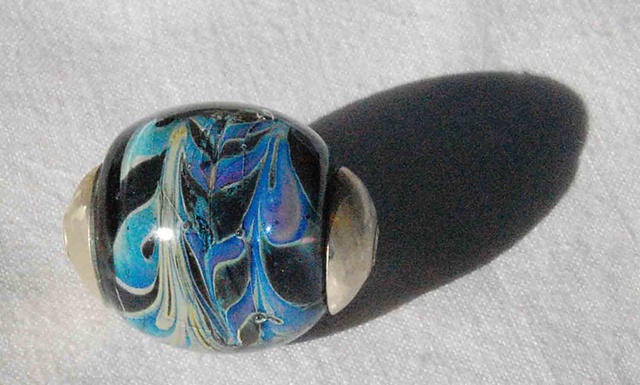 Capped silver bearing bead