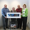 Steve Borgisi presenting his painting to Mr. Castellani at Starlight.
