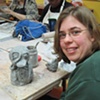 Melissa working on her doll body before the arm or leg holes have been added.