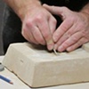 Ken Payne giving casting mold carving demo.