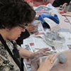 Debbie working on building the body for her ballerina doll sculpture.