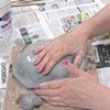 Lisa  creating a ceramic bowl form.