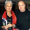Joan Baez with our friend, musician Bass Reaves. Joan is holding a copy of Starlight's poetry book.