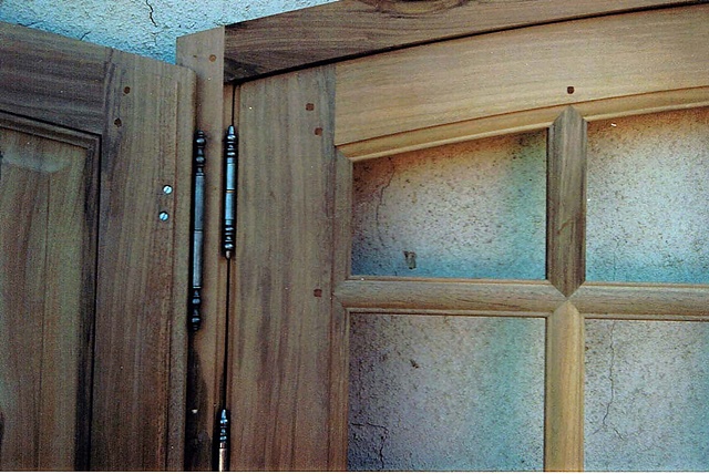 Window with interior shutters. Walnut