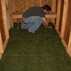 Laying the sod on the interior of the bunker