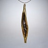 Reticulated silver and brass pendant