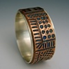 Hand stamped copper and sterling ring