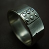 Distressed ring with plate and rivets