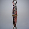 silver and brass pendant
