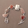 Sterling Silver, stones:  red spotted jasper, moonstone, red river jasper, petrified palmroot, red spotted jasper, red river jasper