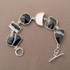 Sterling Silver, stones:  zebra agate, zebra agate, onyx, druzy, psilonomeleane, zebra agate