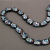 "Sunday In The Park" 

Silver Leaf On Black Glass Beads, Hand Painted - Multi Colored