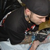 Mike tattooing Piggy D