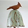Terra Cotta Bird Resting on Bell with Leaf