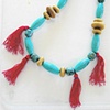 big turquoise and red tassel necklace