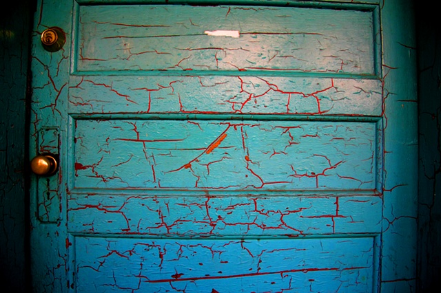 behind the turquoise door